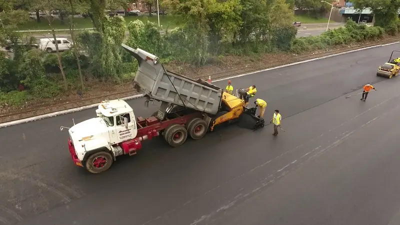 New concrete sidewalk installation with formed edges and finished surface